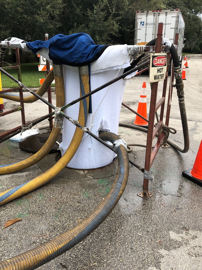 New sewer liner being installed through manhole Tiber-Olive project New sewer liner being installed through manhole Tiber-Olive project